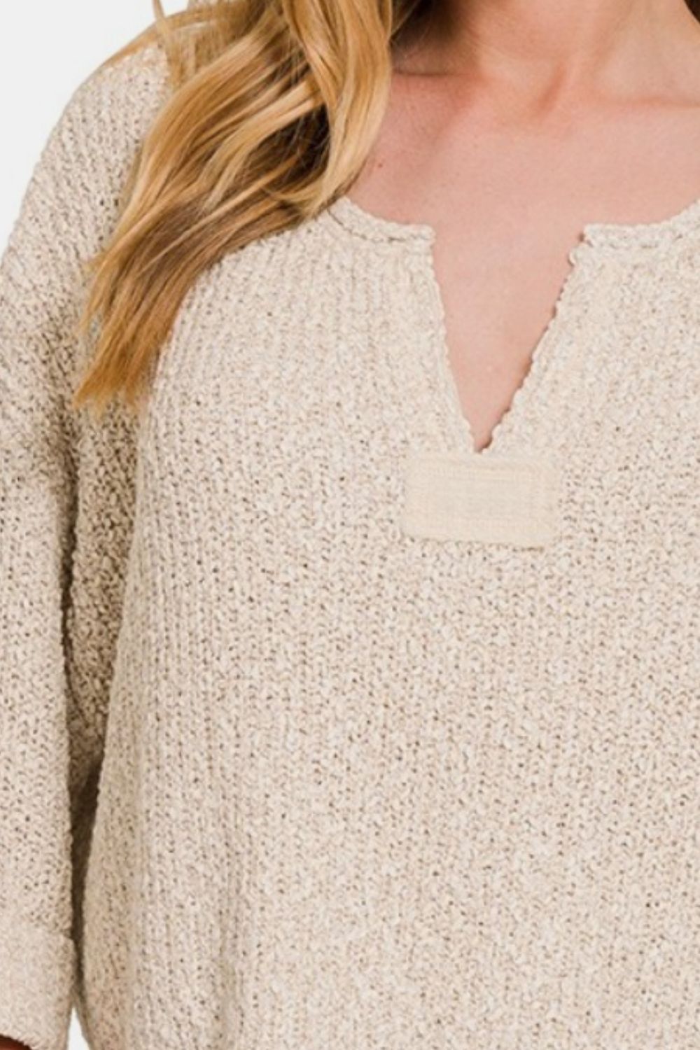 Beige notched side slit patch sweater with short sleeves, made of soft stretch fabric for a modern and comfortable fit.