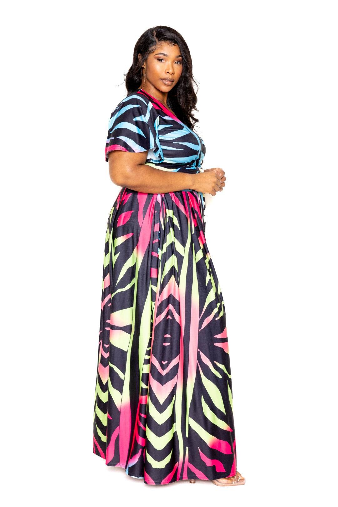 Plus size model wearing colorful ombre animal print maxi skirt and top set in polyester fabric, available in 1XL to 3XL.