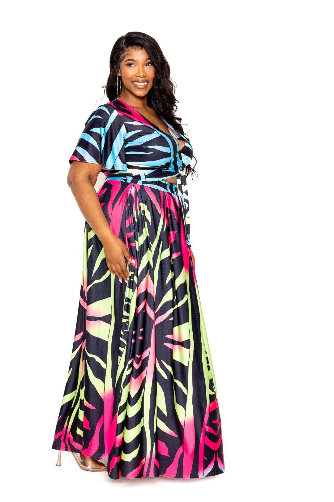 Plus size woman wearing vibrant ombre animal print maxi skirt and top set in 1XL, 2XL, and 3XL sizes, 100% polyester fabric.