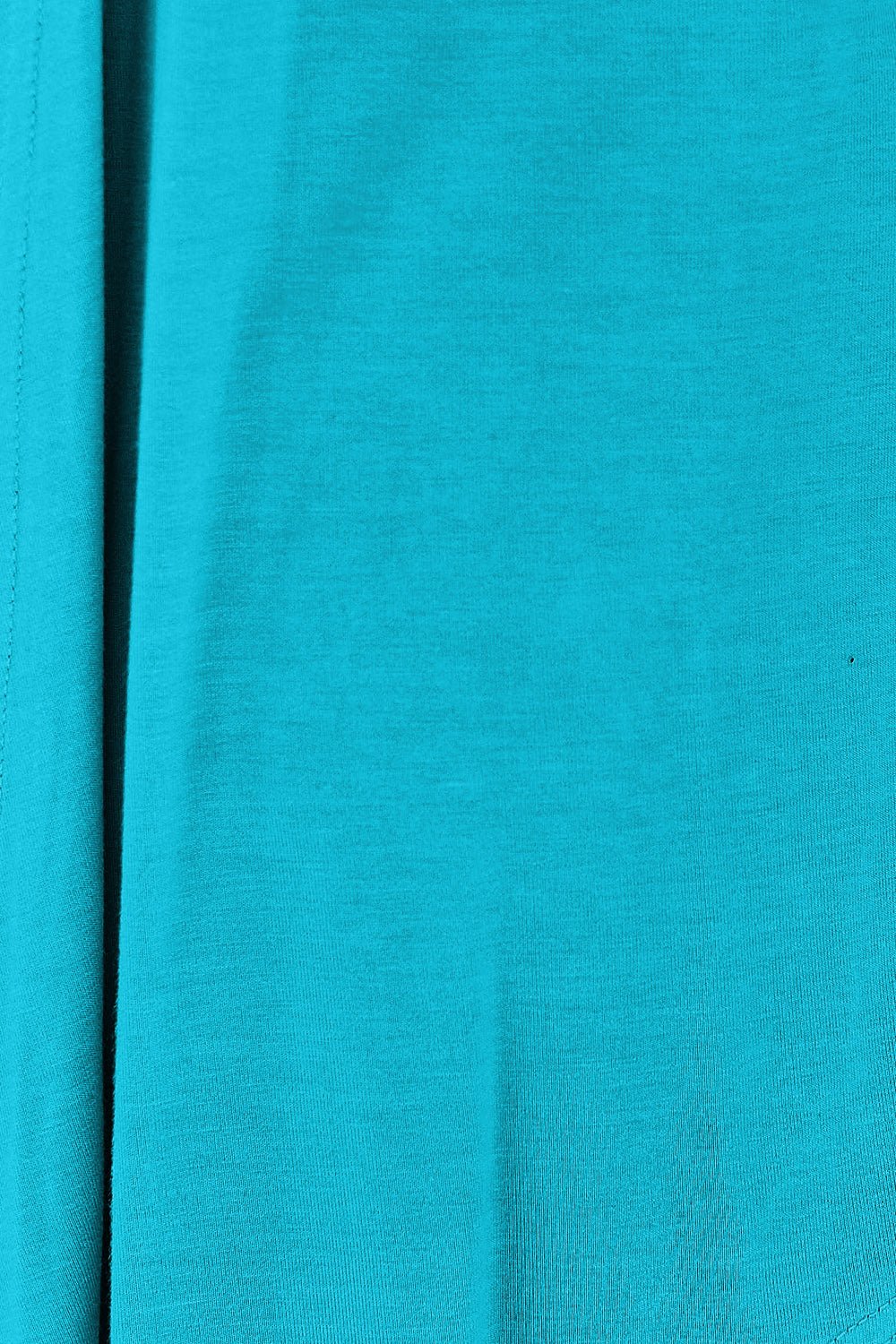 Close-up of turquoise open front long sleeve cardigan fabric with slightly stretchy rayon and spandex blend.