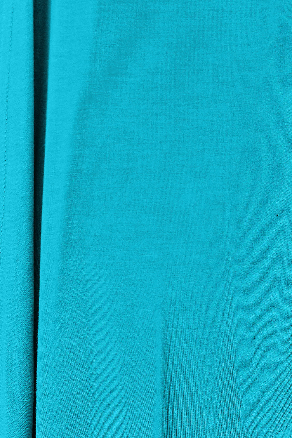 Close-up of turquoise open front long sleeve cardigan fabric with slightly stretchy rayon and spandex blend.