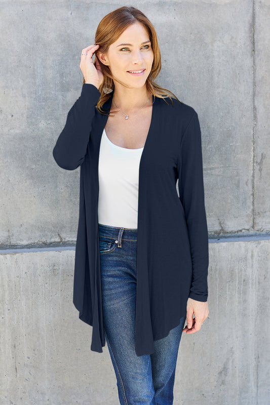 Woman wearing open front long sleeve cardigan with jeans, showcasing basic style and slightly stretchy material composition