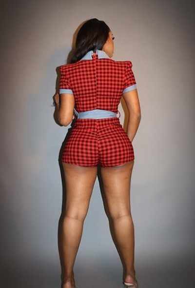 Red plaid print denim romper with button-up closure, wide belt, and high stretch, showcasing back view.