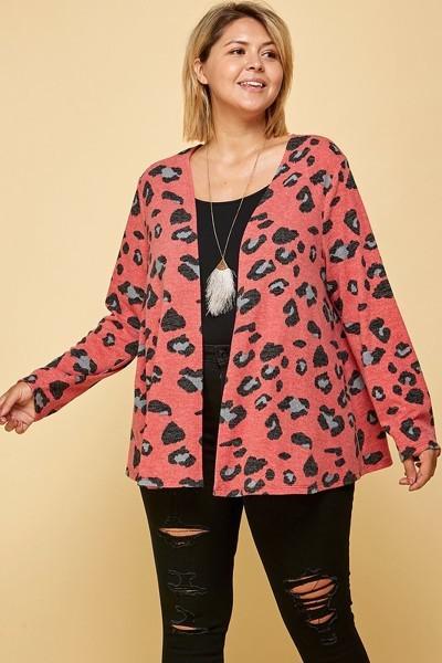 Plus size red animal print open front cropped cardigan, made in USA, worn by model with black top and ripped jeans.