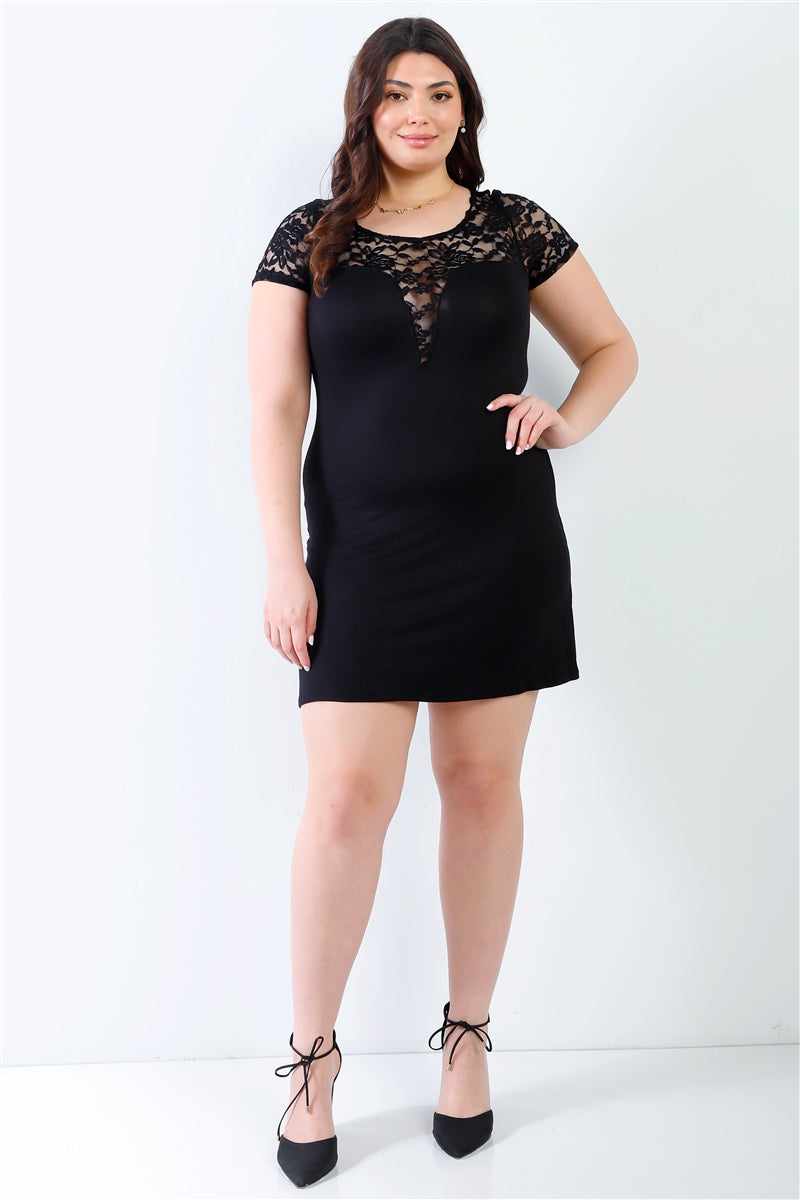 Plus size black mini dress with lace detail, short sleeves, and round neckline, showcasing elegant and chic style.