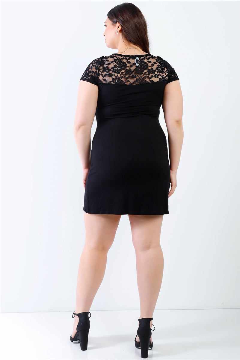 Plus size black lace detail mini dress with short sleeves, round neckline, and elegant back view.