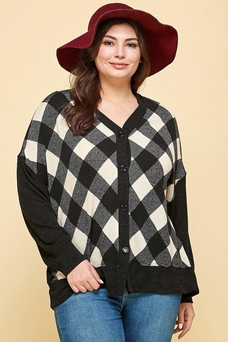 Plus size woman wearing a Buffalo plaid oversize cardigan with a red hat, showcasing fashion style and comfort.