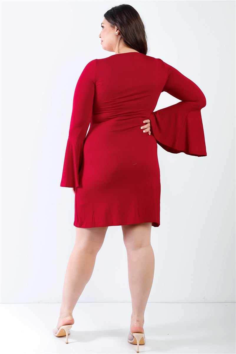 Plus size burgundy mini dress with bell sleeves, round neckline, and slim fit, shown from the back on a model.