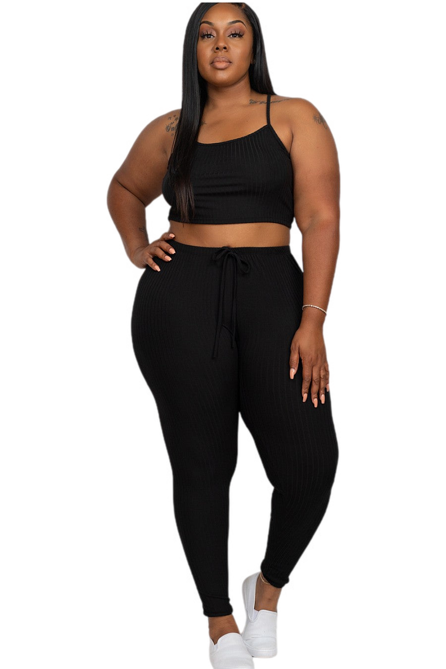 Plus size model wearing black cropped cami and leggings set, rib knit fabric, soft stretch, casual women's fashion outfit