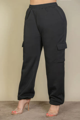 Plus size black drawstring waist sweatpants with side pockets, showcasing a stylish and comfortable fit ideal for women's loungewear.