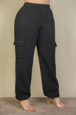 Black plus size drawstring waist sweatpants with side pockets, paired with clear high heels, showcasing a chic and comfortable look.