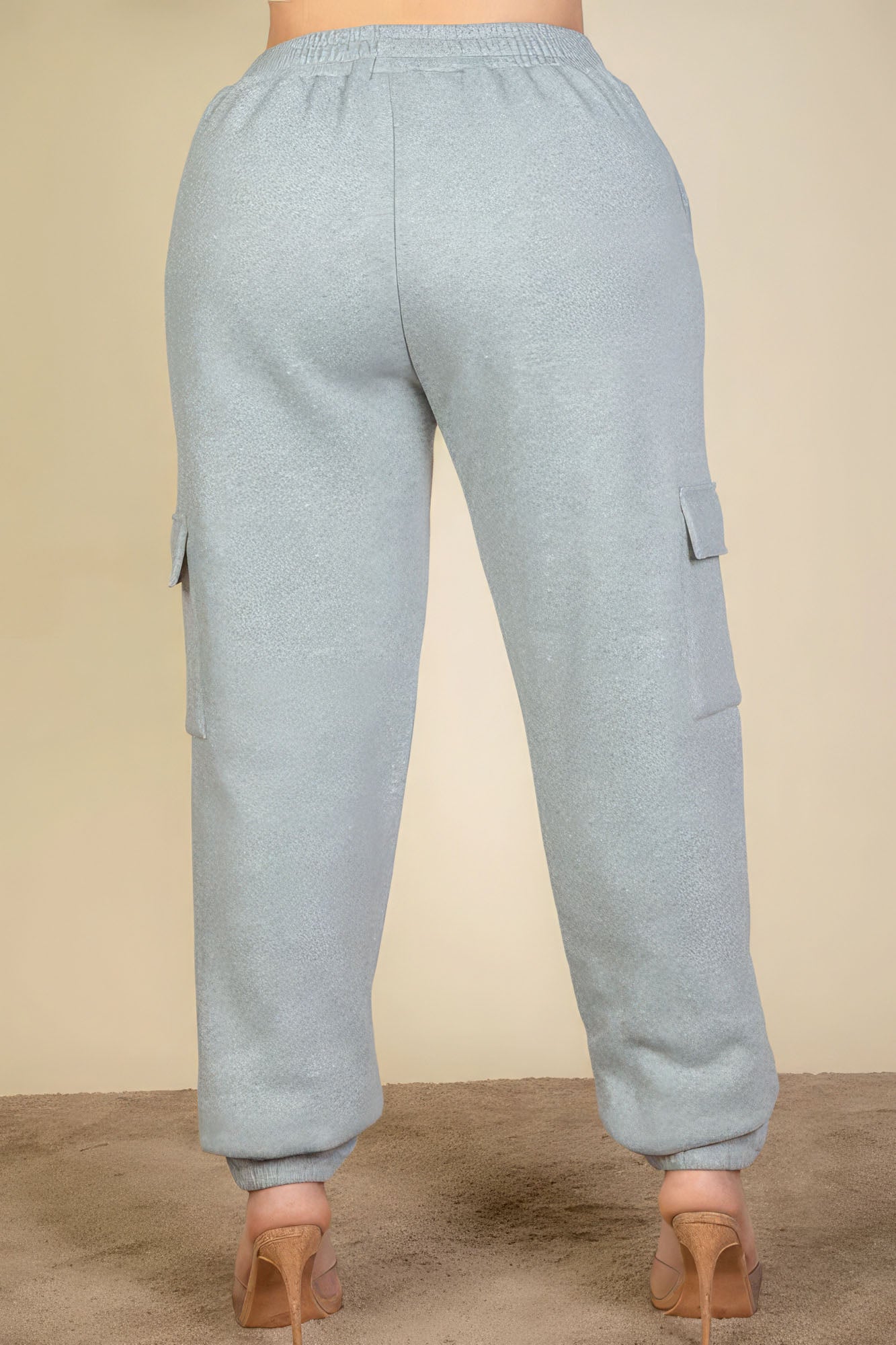 Plus size side pocket drawstring waist sweatpants in light blue, back view, showcasing comfortable fit and stylish design.