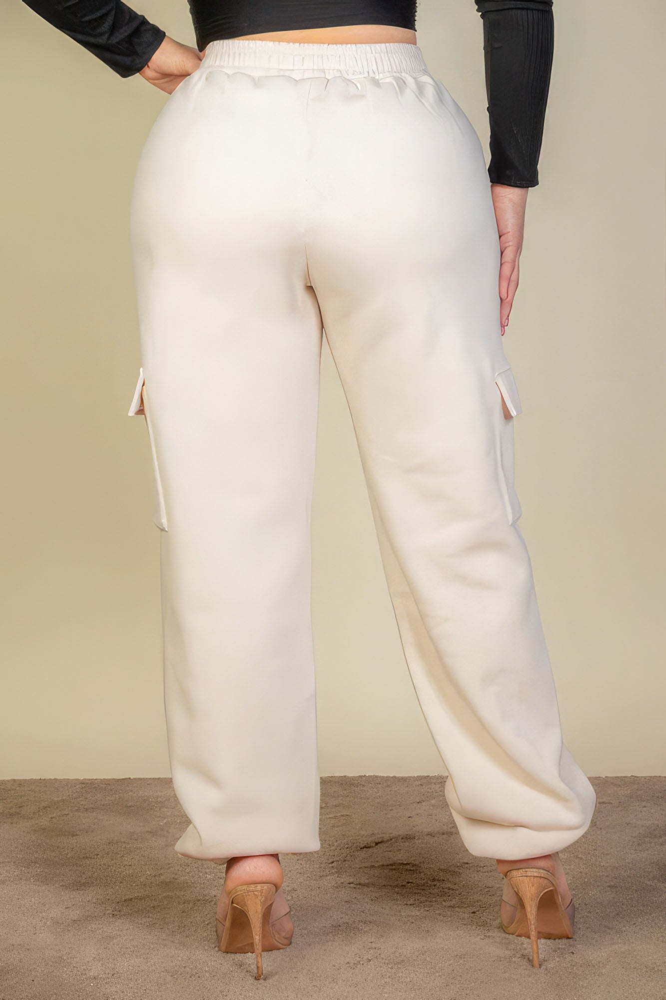 Back view of plus size sweatpants with side pockets and drawstring waist, showcasing soft fabric and comfortable fit.