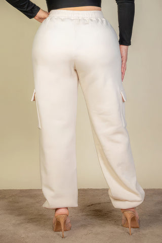 Back view of plus size sweatpants with side pockets and drawstring waist, showcasing soft fabric and comfortable fit.