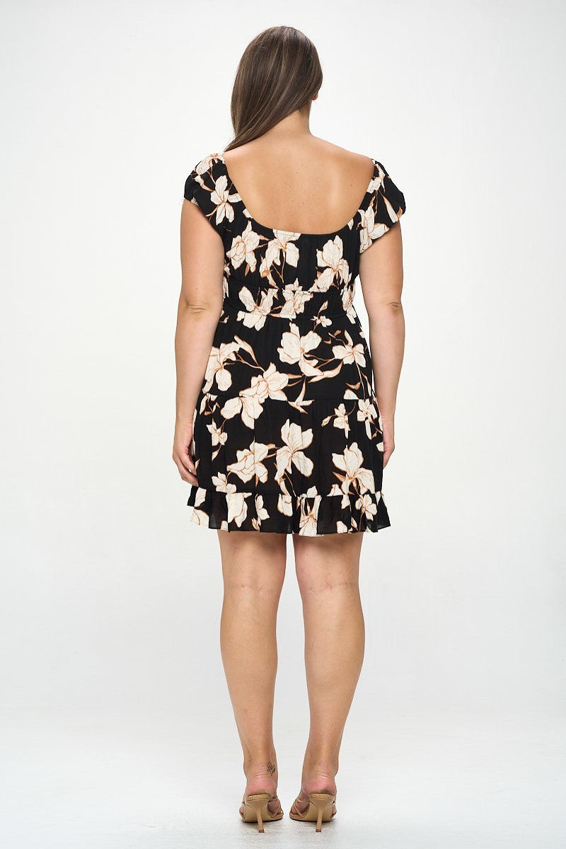 Plus size floral ruffle mini dress in black with front tie, shown from the back, featuring elegant floral pattern, 100% rayon.