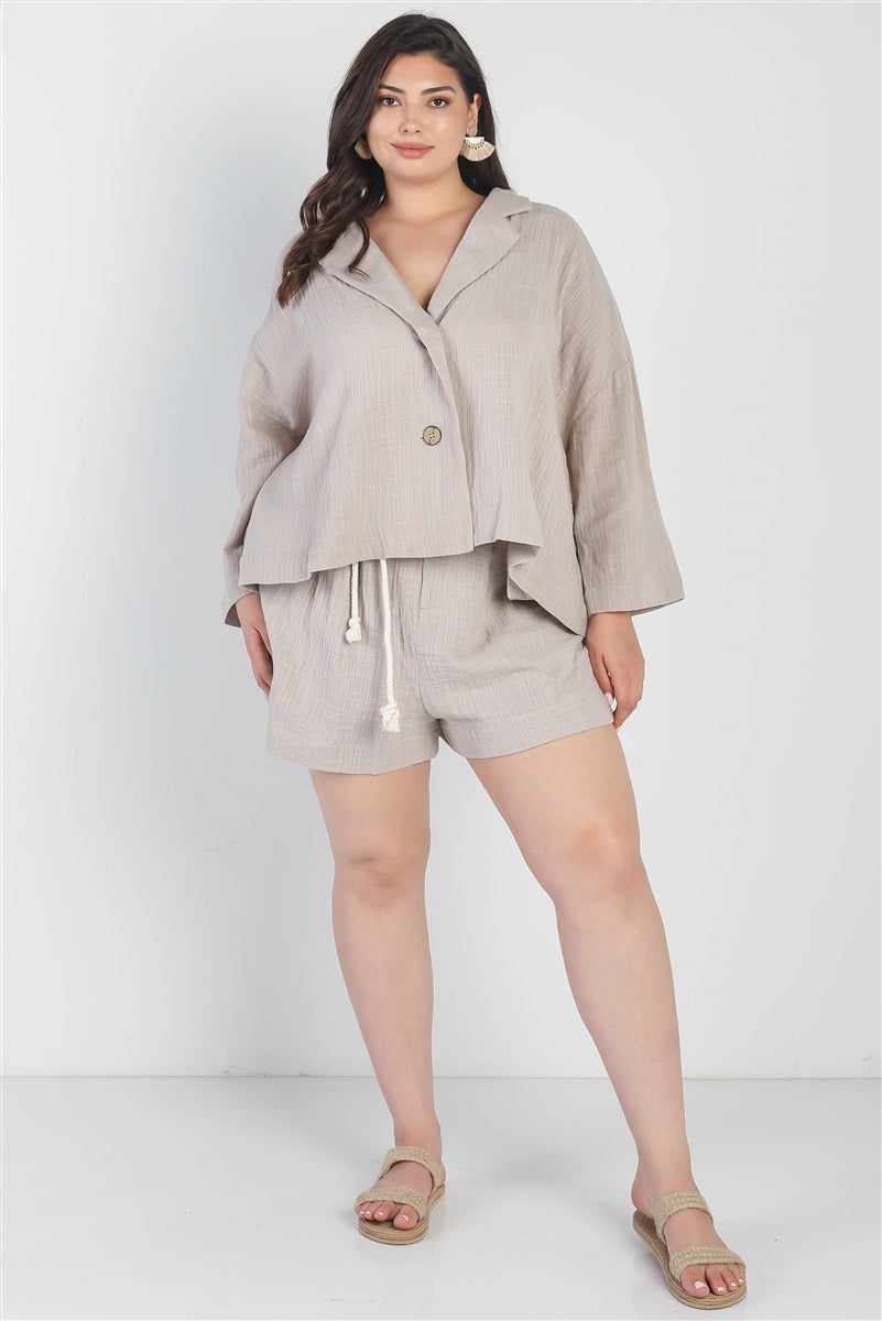 Plus size grey blazer and high waist shorts set with collared v-neckline and self-tie belt, perfect for relaxed fit style.