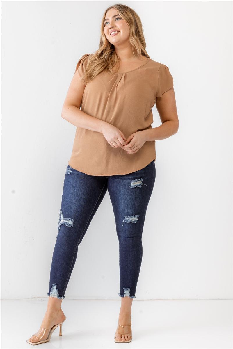 Plus size khaki textured short sleeve blouse with cap sleeves, crew neckline, and back button loop, paired with ripped jeans.