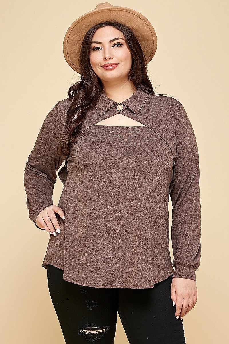 Plus size woman wearing brown long sleeve fashion top with cut out collar and button neckline, paired with a stylish hat.