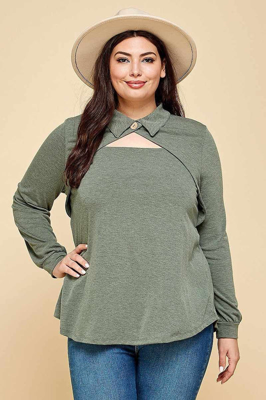 Plus size model wearing olive long sleeve top with cut out collar and button neckline, styled with a hat for a fashion-forward look.