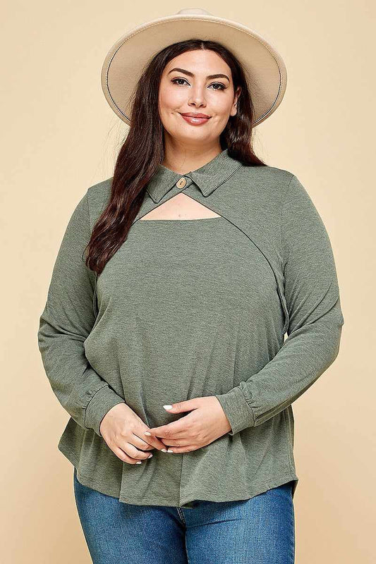 Plus size olive long sleeve top with cut out collar detail and button neckline, modeled with a hat.