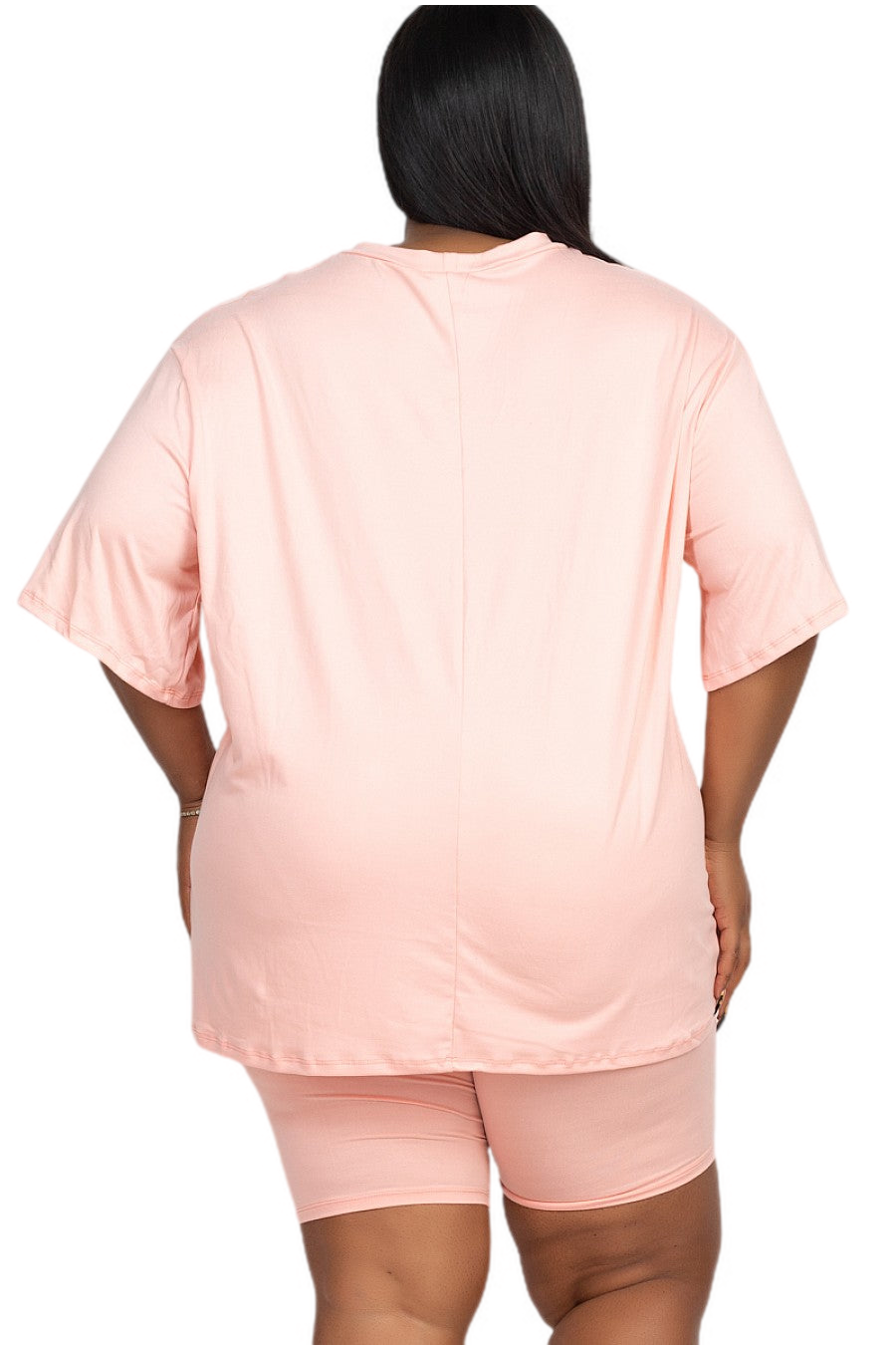 Plus size loose fit top and biker shorts set in light pink, back view. Comfortable, lightweight, and breathable fabric.
