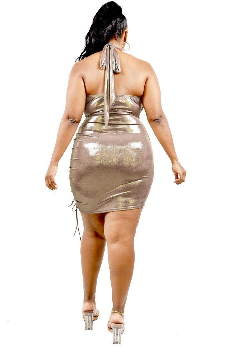 Plus size metallic mauve halter mini dress with cross wrap and tie side detail, back view showcasing cutout and stretch fabric.