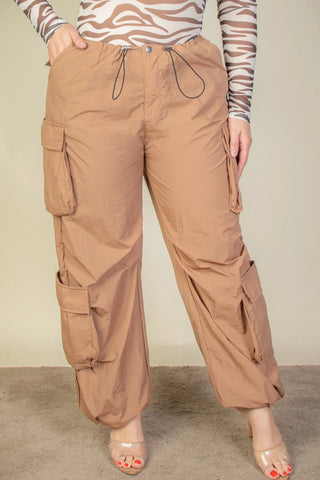 Plus size flap pockets drawstring ruched parachute pants in brown, featuring a lightweight nylon fabric and stylish design.