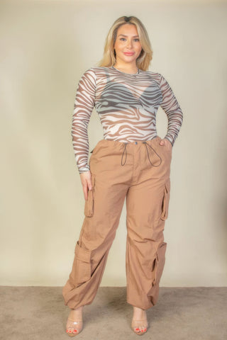 Plus Size Flap Pockets Drawstring Ruched Parachute Pants in brown, modeled with a zebra print top, showcasing a stylish and versatile look.