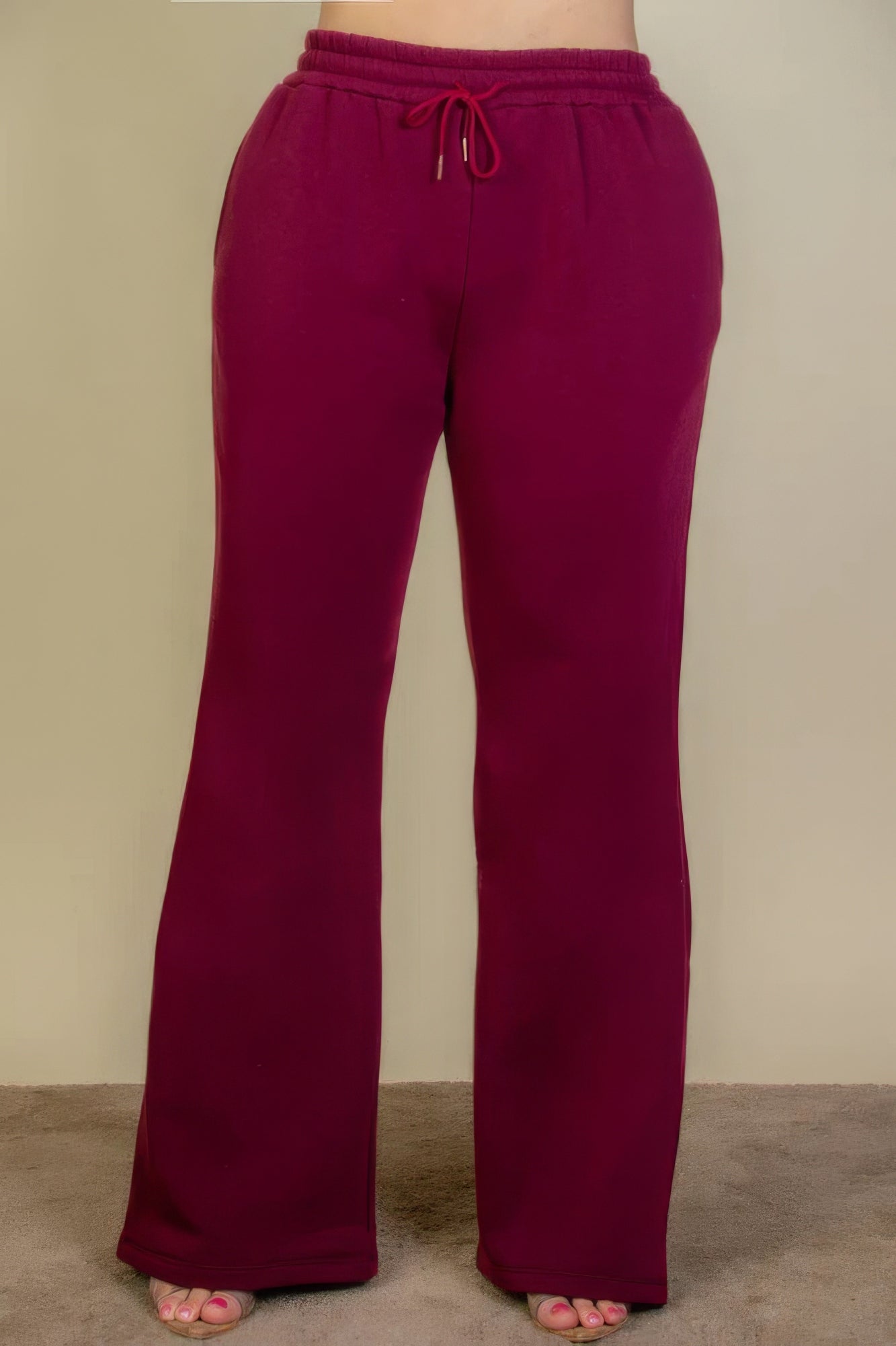 Plus size burgundy sweatpants with drawstring waist and bootcut design for stylish comfort.