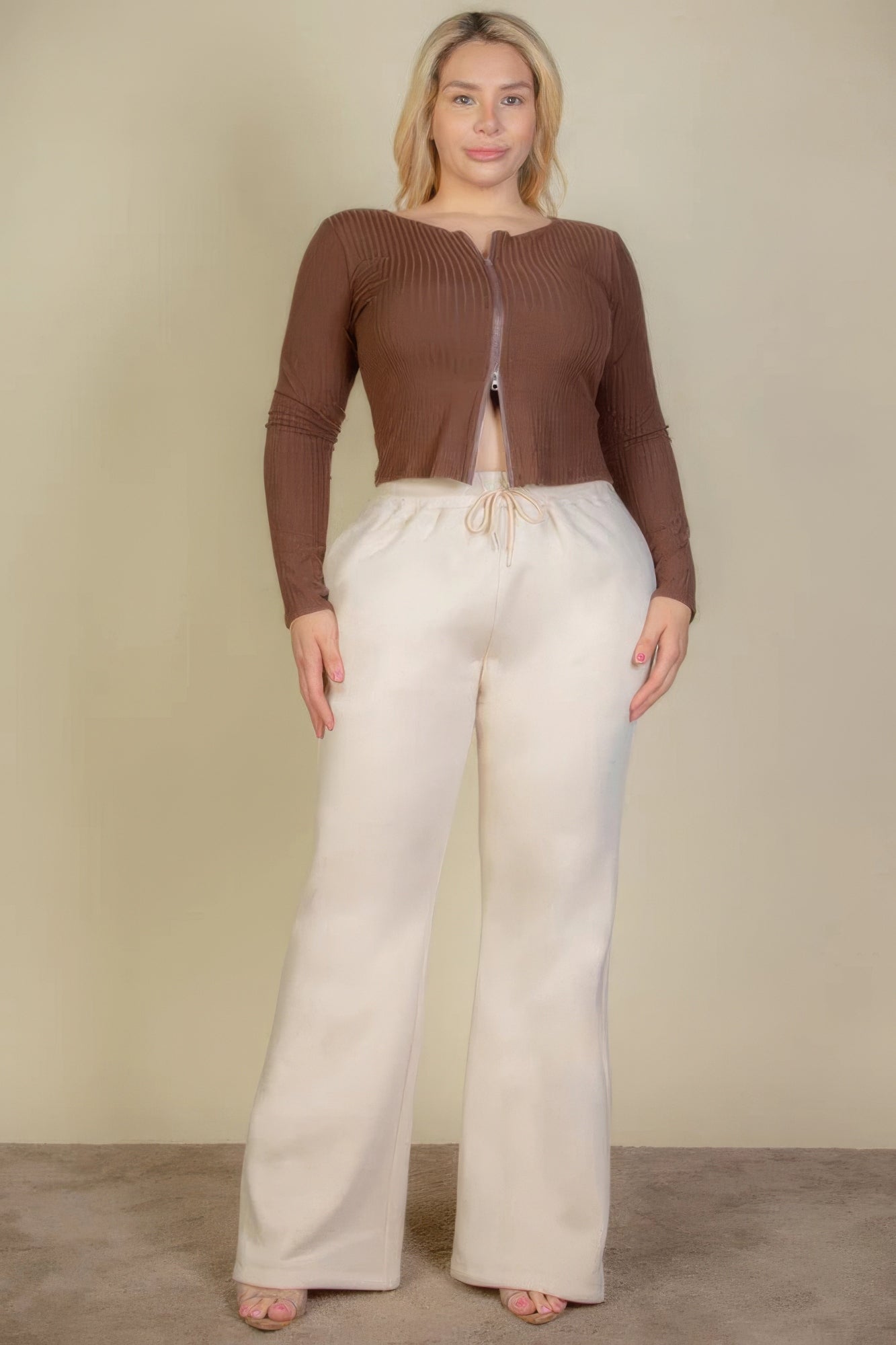 Plus size drawstring waist sweatpants with slant pockets in chic neutral color, perfect for casual wear and lounging.