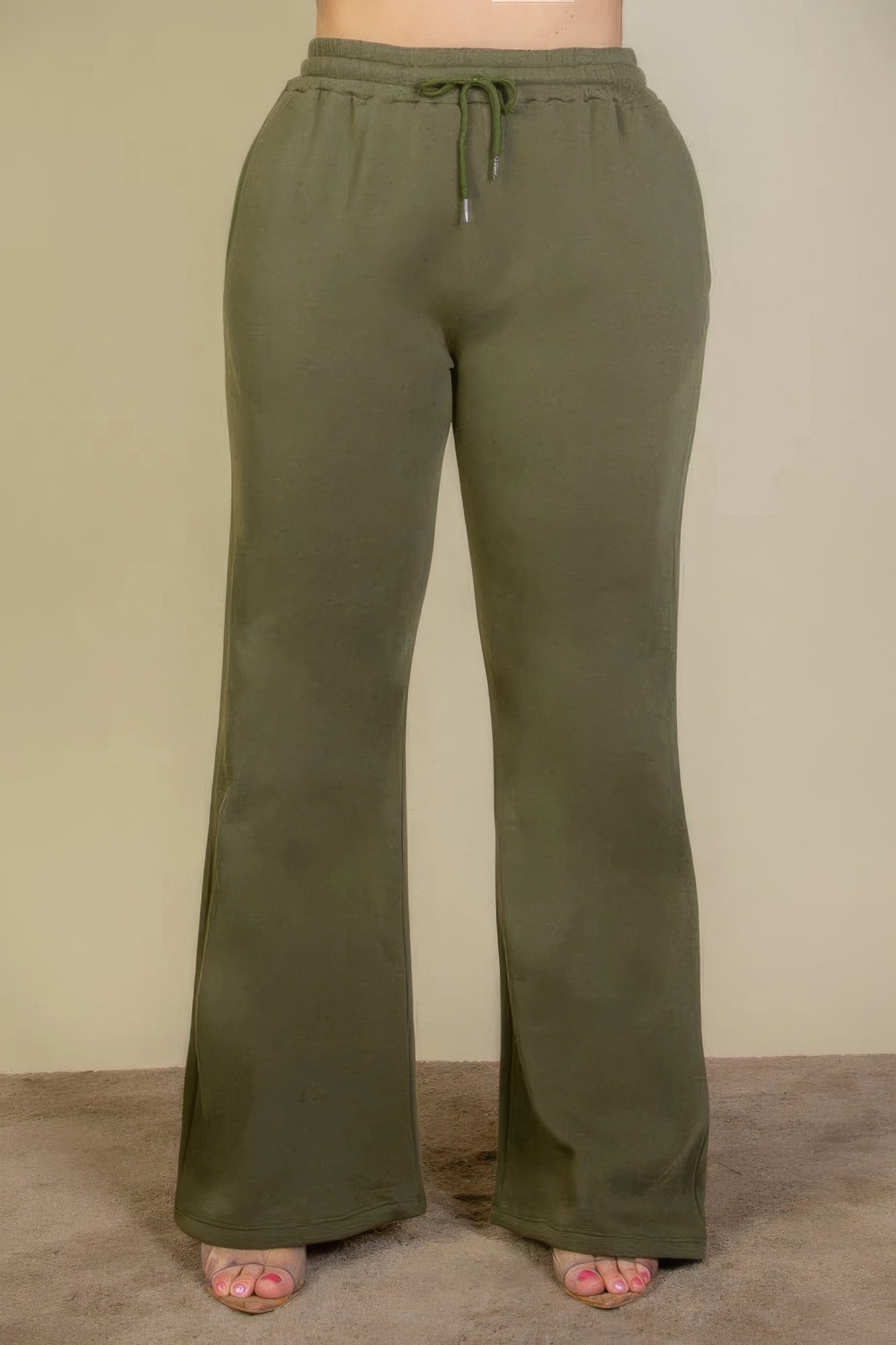 Olive plus size bootcut sweatpants with drawstring waist and slant pockets, perfect for casual wear and activities.