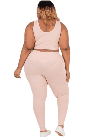 Plus size ribbed crop top and leggings set in pink, showcasing comfortable and stylish loungewear for women.