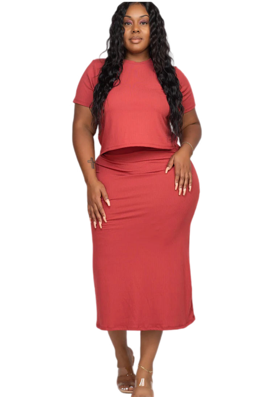 Plus size ribbed solid top and midi skirt set in red, featuring a soft, high stretch fabric with elasticized waist, worn by model.