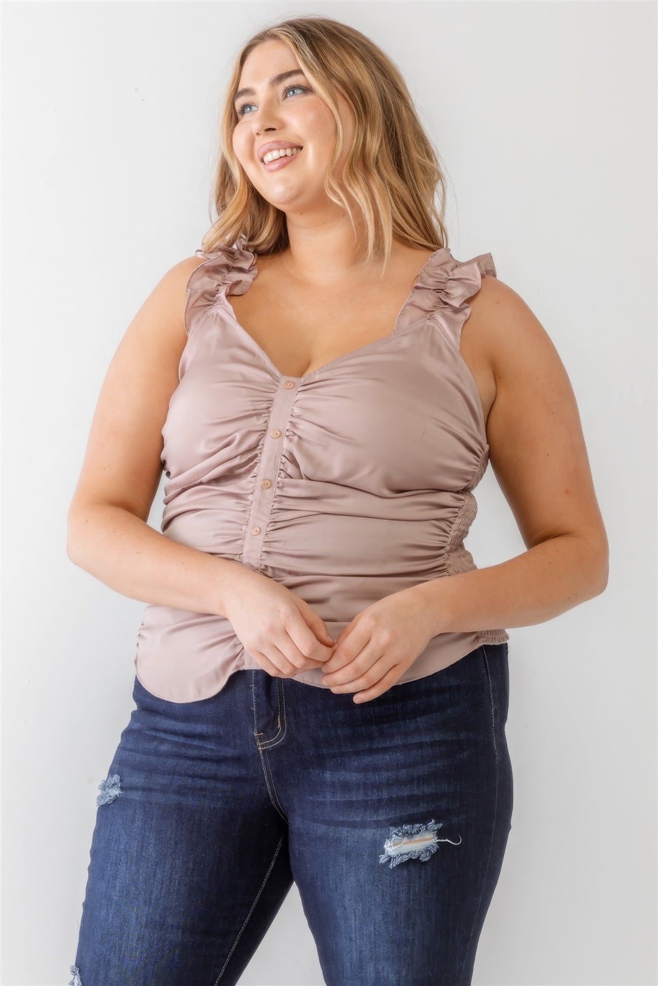 Plus-size mauve tank top with ruched button-up front, ruffle straps, and smocked back worn by model in jeans.