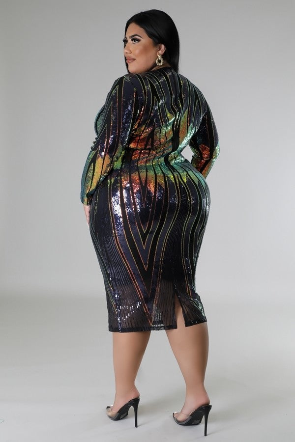 Plus size sequin stretch midi dress with long sleeves, V-cut design, and zipper closure in multi-color, back view.