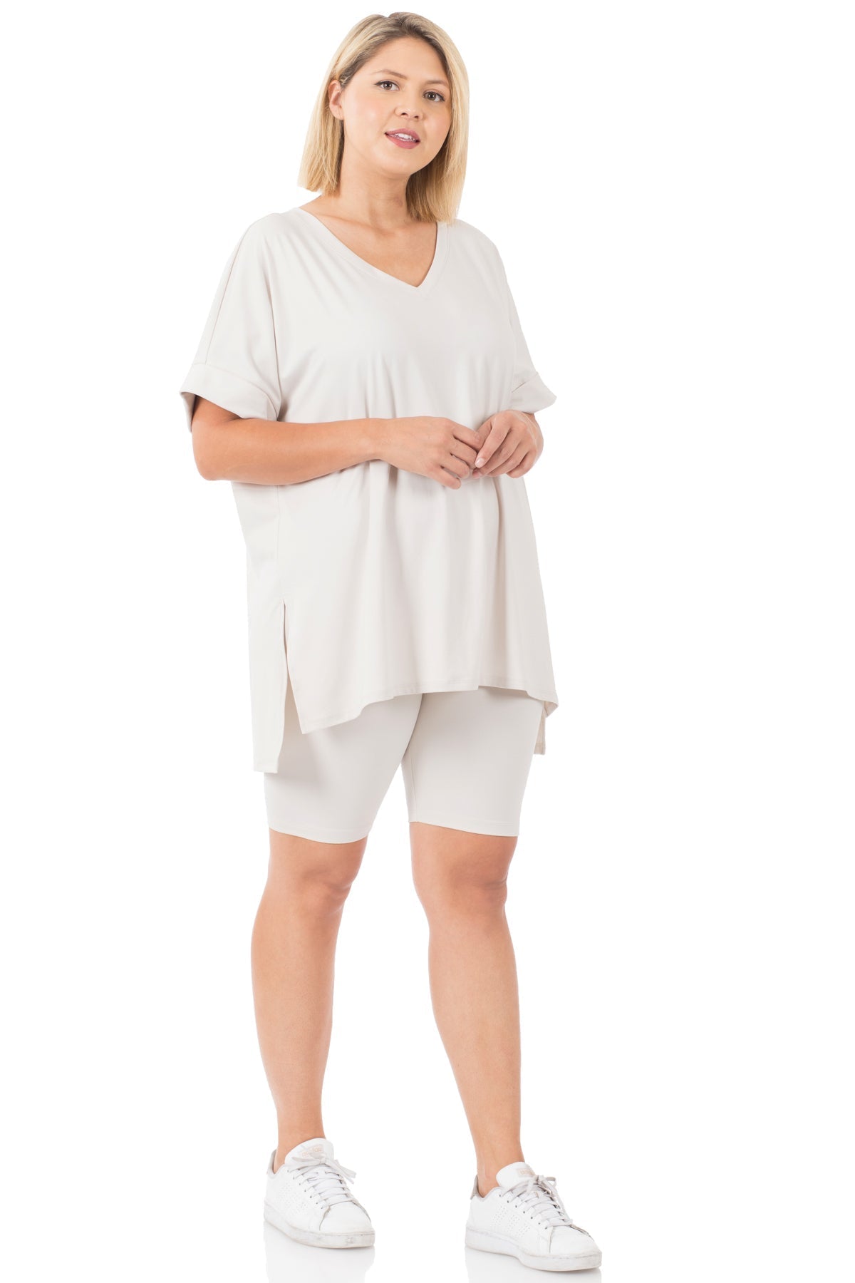 Plus-size brushed microfiber V-neck top with hi-low hem and biker shorts set in cream, featuring buttery soft fabric and perfect stretch.