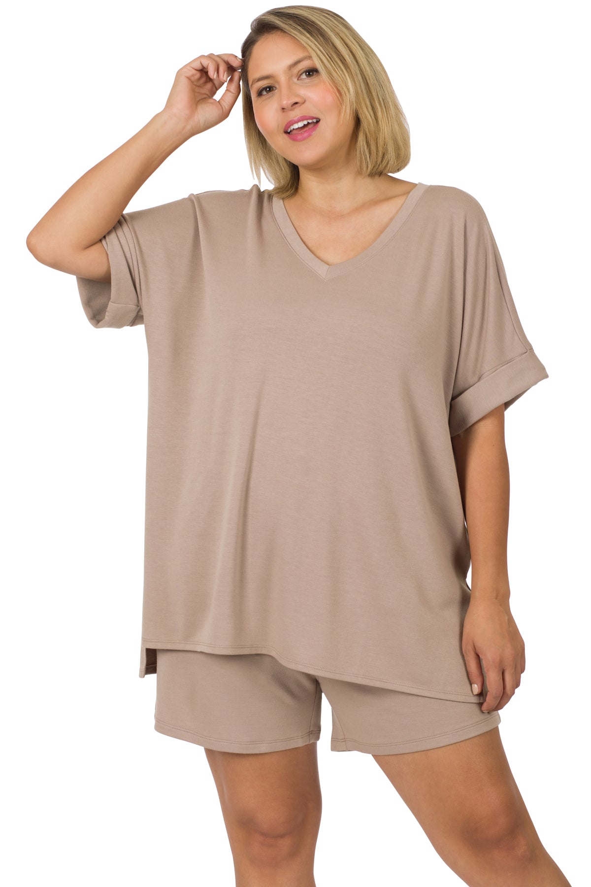 Woman wearing a plus size soft French terry loungewear set with V-neck hi-low hem top and drawstring elastic waist shorts in beige.