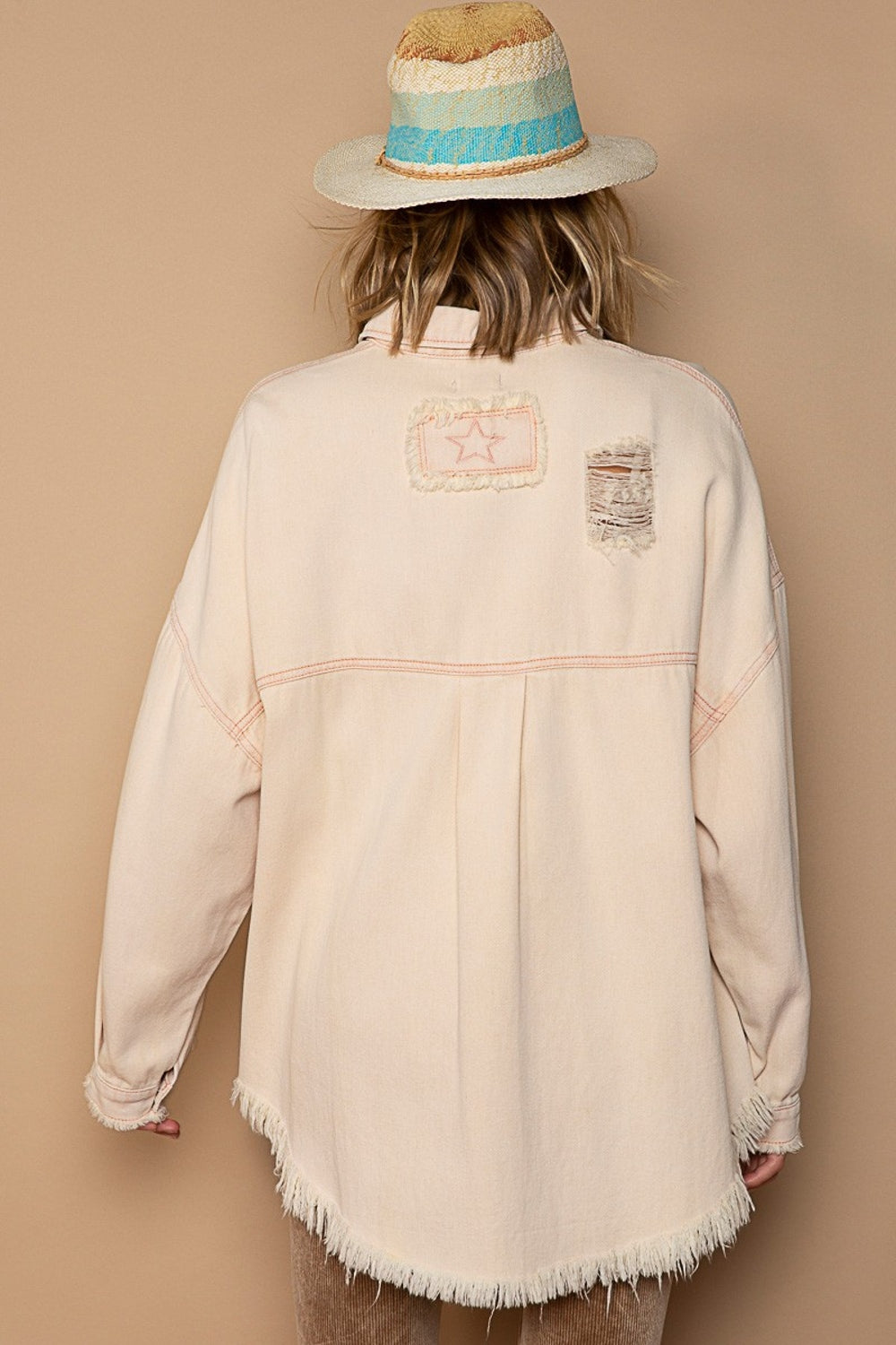 Pink beige distressed raw hem shacket with button-down back view for trendy layering style