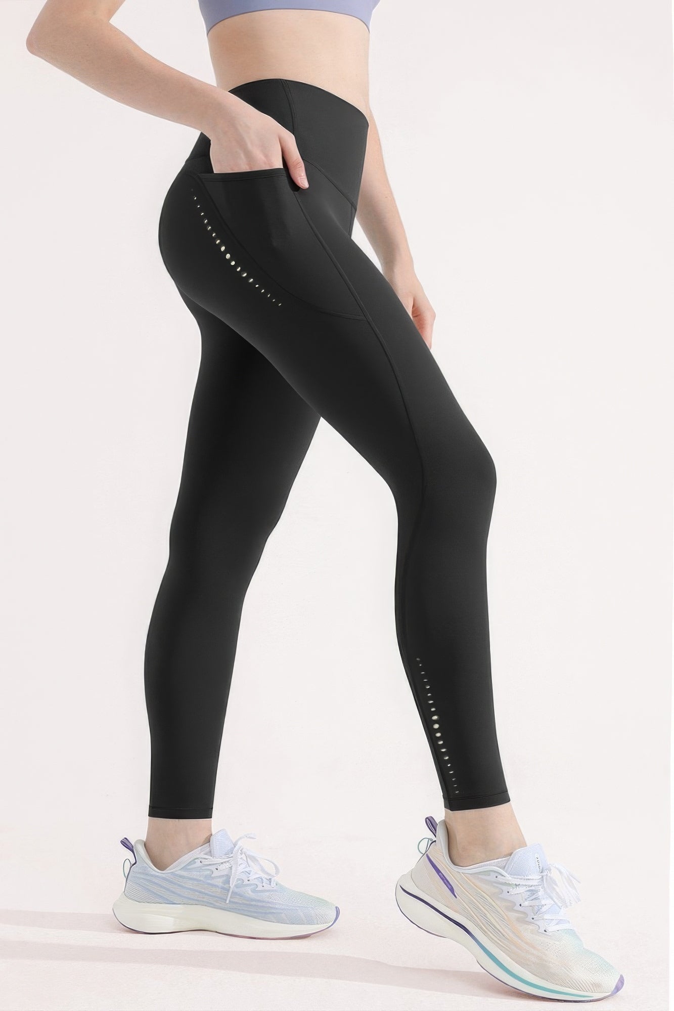 High-waisted premium yoga leggings with pocket, reflective dots, and sleek fit in black for gym or casual wear