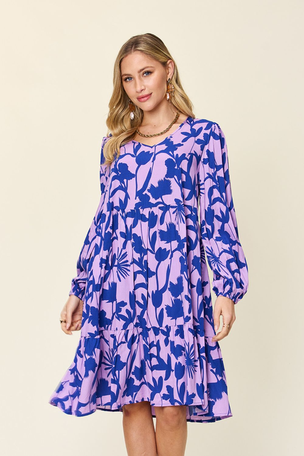 Printed ruffle hem dress with pockets in blue and purple, long sleeves, perfect for casual outings, 100% rayon material.