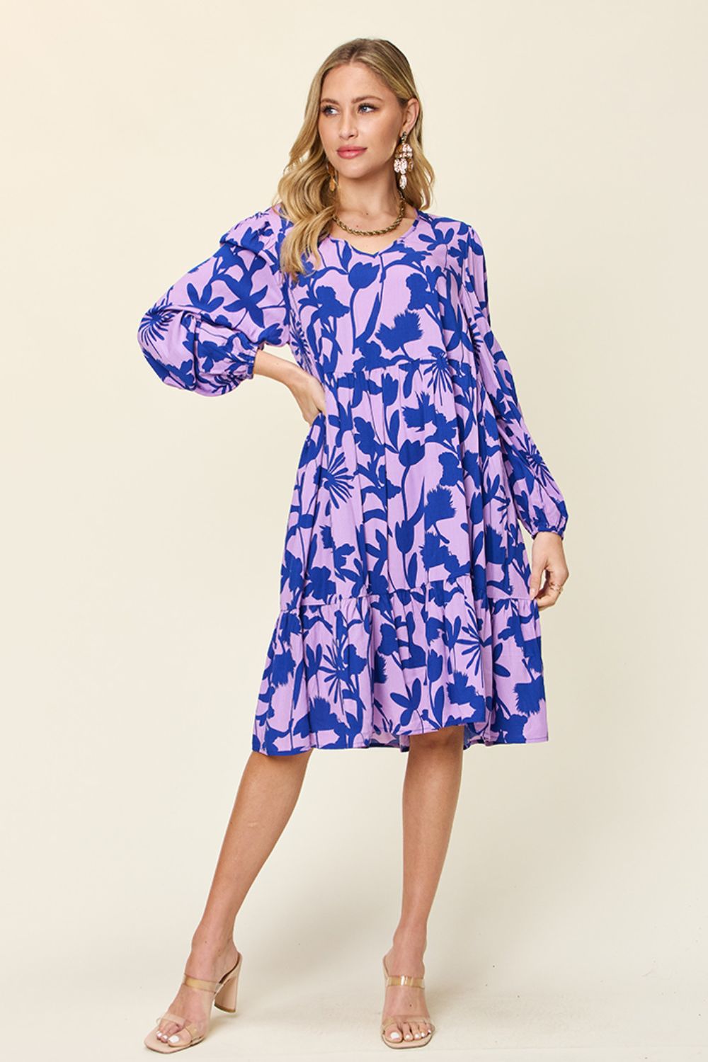 Printed ruffle hem dress with pocket, featuring a floral design in blue and pink, perfect for a stylish, casual look.