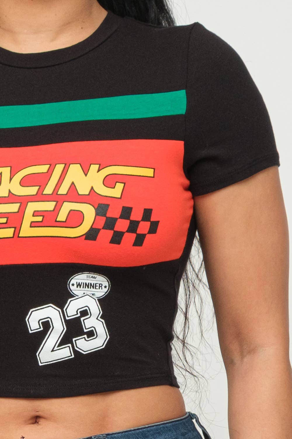 "Front Racing Speed crop top with screen print, cotton spandex blend, round neck, short sleeves, model wearing size medium"