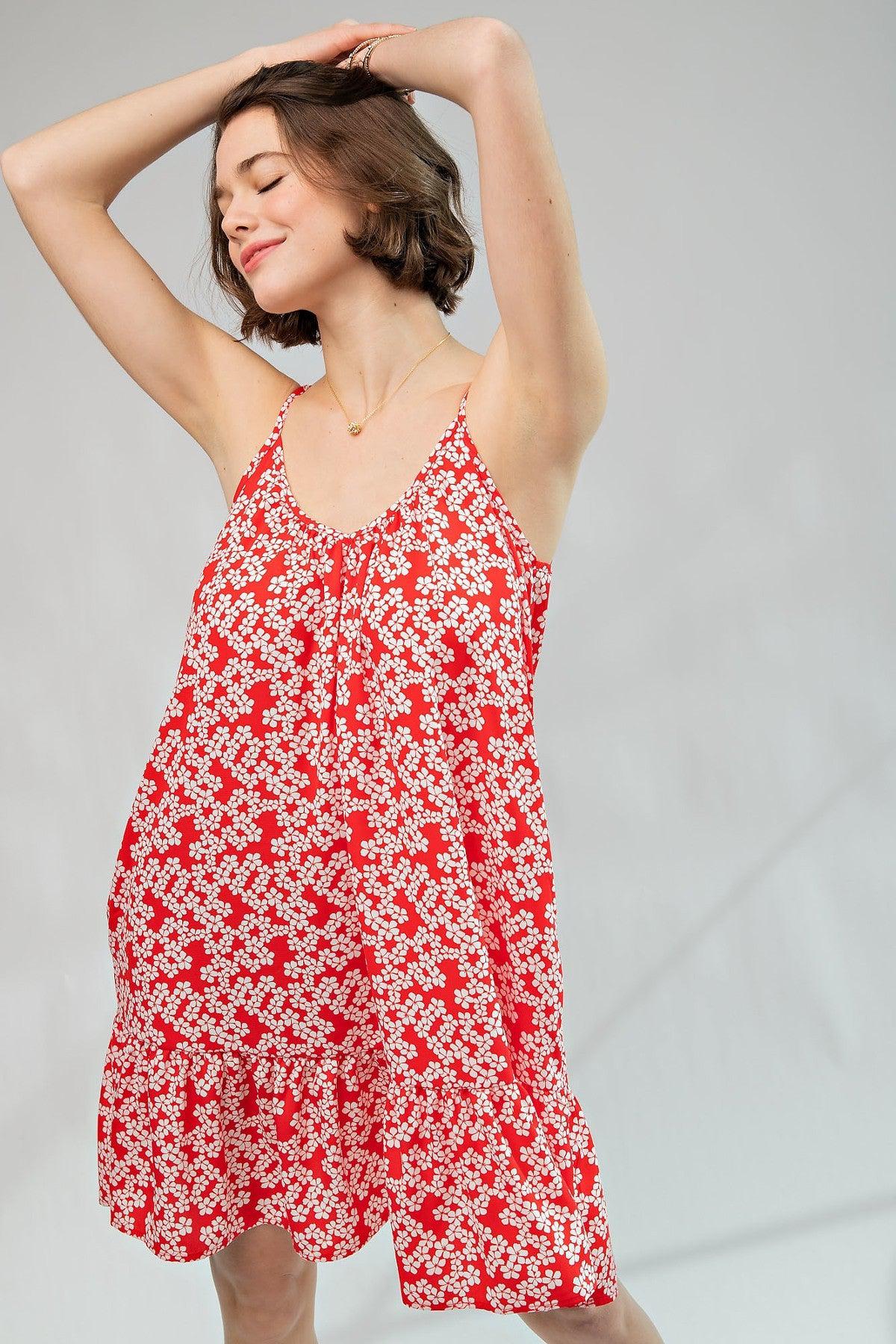 Red floral printed wool peach cami dress with scoop neckline, ruffled bottom, spaghetti straps, and relaxed fit, made in USA.