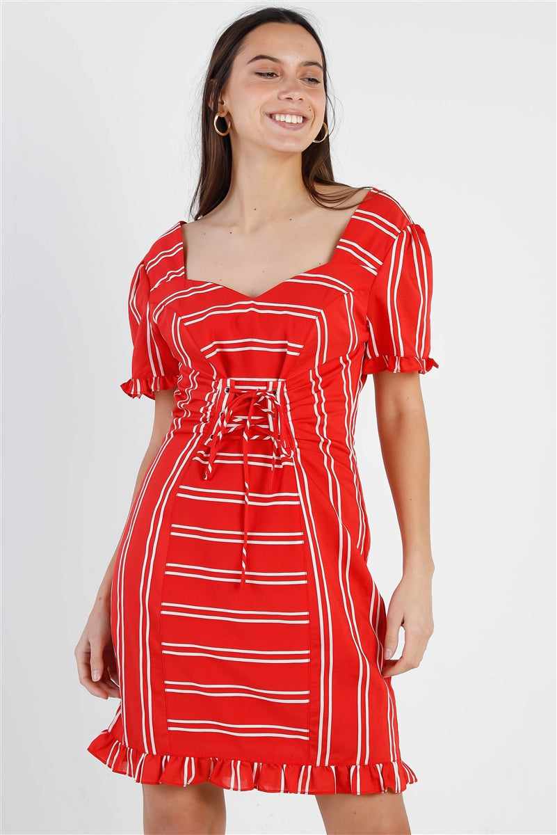 Woman wearing red stripe lace-up dress with ruffle trim and balloon sleeves, featuring heart-shaped neckline and fitted waistline.