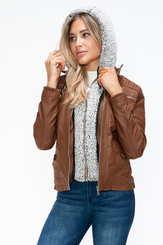Woman wearing removable faux layered multi-pocket pleather jacket with fuzzy hood, showcasing the basic style and normal thickness.