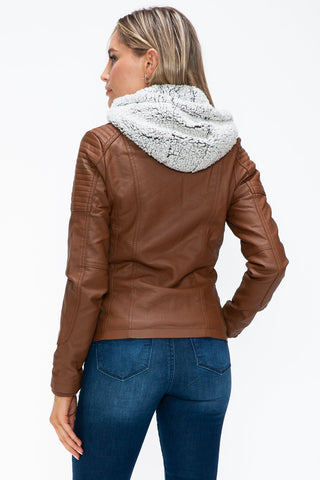 Brown faux leather jacket with a removable fuzzy hood and multiple pockets, worn by a model, viewed from the back.