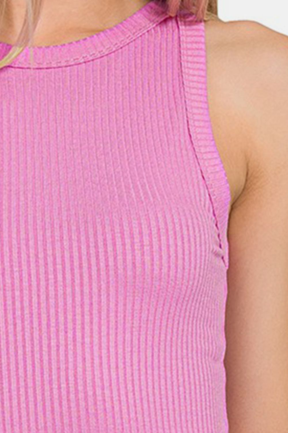 Pink ribbed crew neck tank top made of 95% rayon and 5% spandex, showcasing slightly stretchy, opaque material.