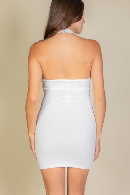 Back view of white ribbed halter neck backless bodycon mini dress on model.