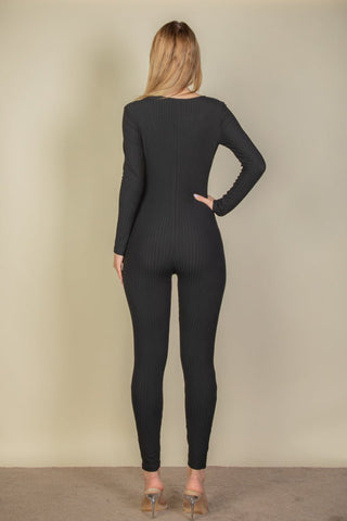 Back view of a black ribbed scoop neck long sleeve jumpsuit, made with soft and lightweight high-stretch fabric for comfort and style.