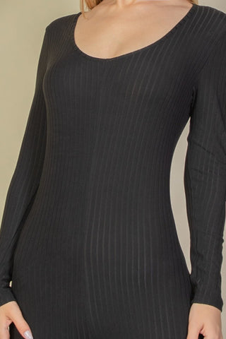Close-up of black ribbed scoop neck long sleeve jumpsuit made of soft, high-stretch rib knit fabric with 92% polyester and 8% spandex.